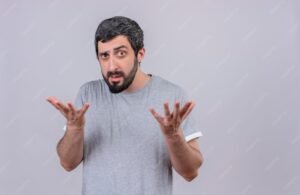 confused young handsome caucasian man showing empty hands isolated white with copy space 141793 77292