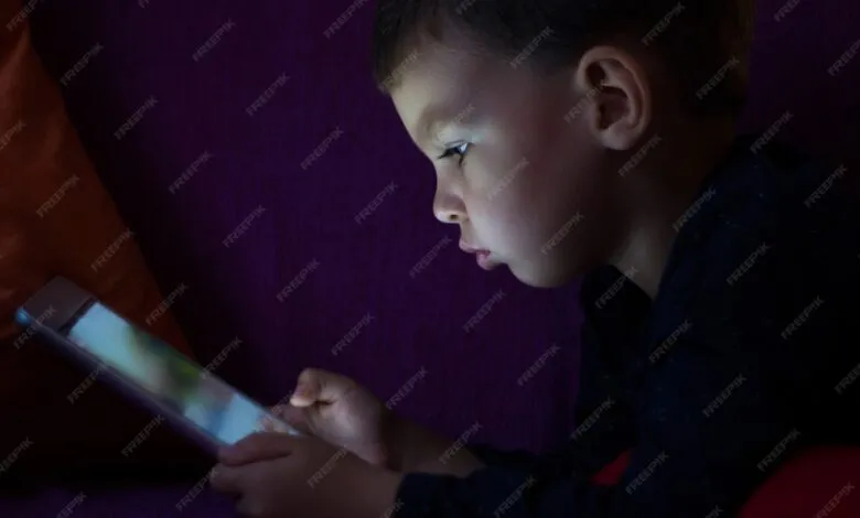 cute kid with tablet dark 1212 867
