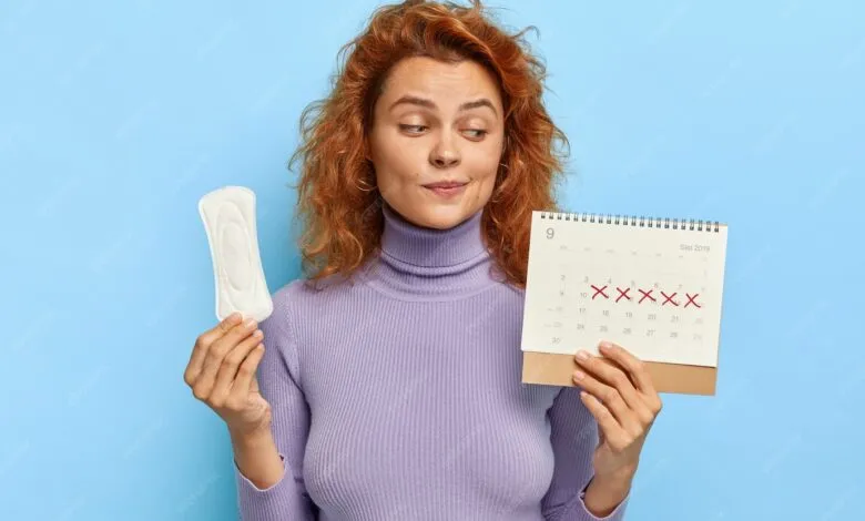 photo young woman looks period calendar checks menstruation days 273609 30253