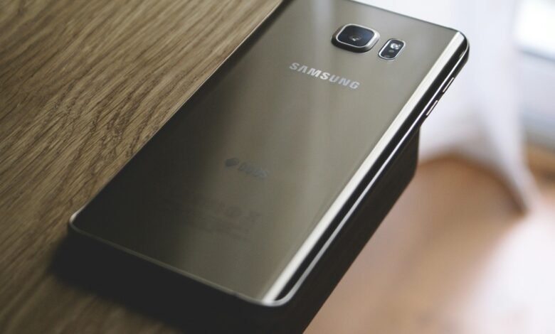 A sleek Samsung smartphone placed on a wooden surface, capturing modern elegance.