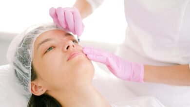 Woman receives cosmetic injection in clinical setting, enhancing beauty using modern techniques.