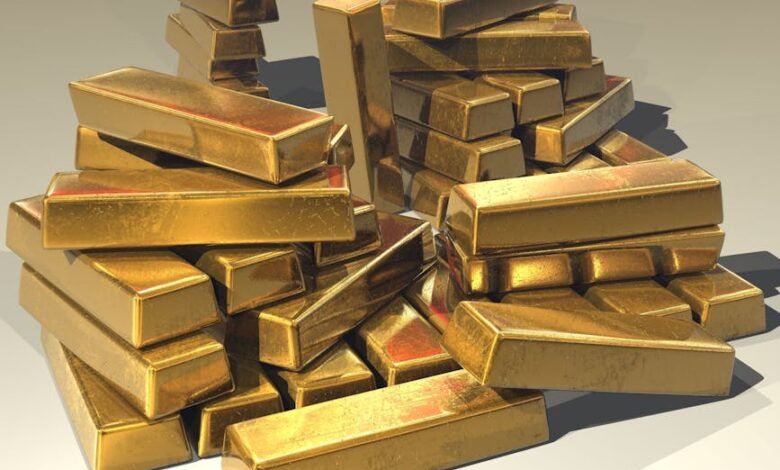 A pile of lustrous gold bars symbolizing wealth and prosperity.