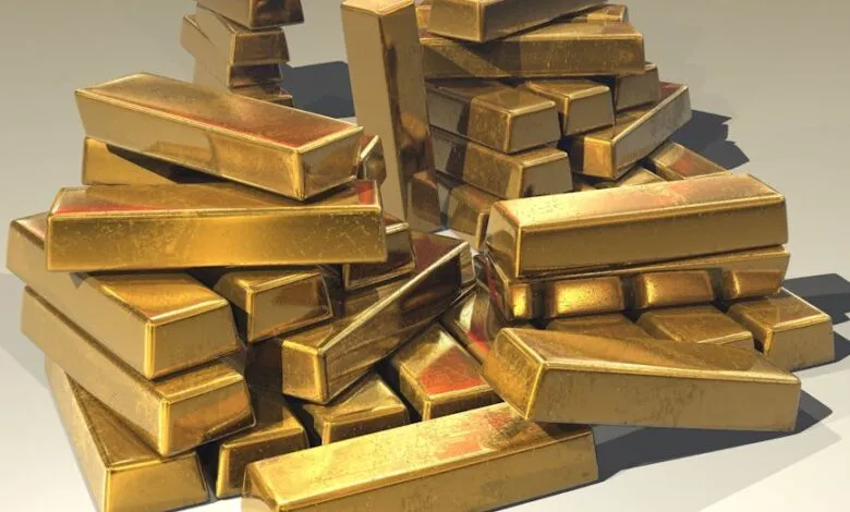 A pile of lustrous gold bars symbolizing wealth and prosperity.