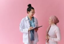 A doctor and cancer patient sharing a positive moment with empathy and care.