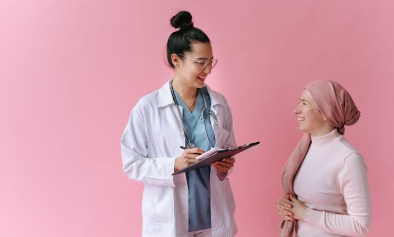 A doctor and cancer patient sharing a positive moment with empathy and care.